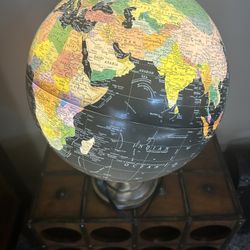  The Orion desktop globe features a 12" black ocean illuminated globe with political map styling's mounted on a silver finish steel stand with semi-me