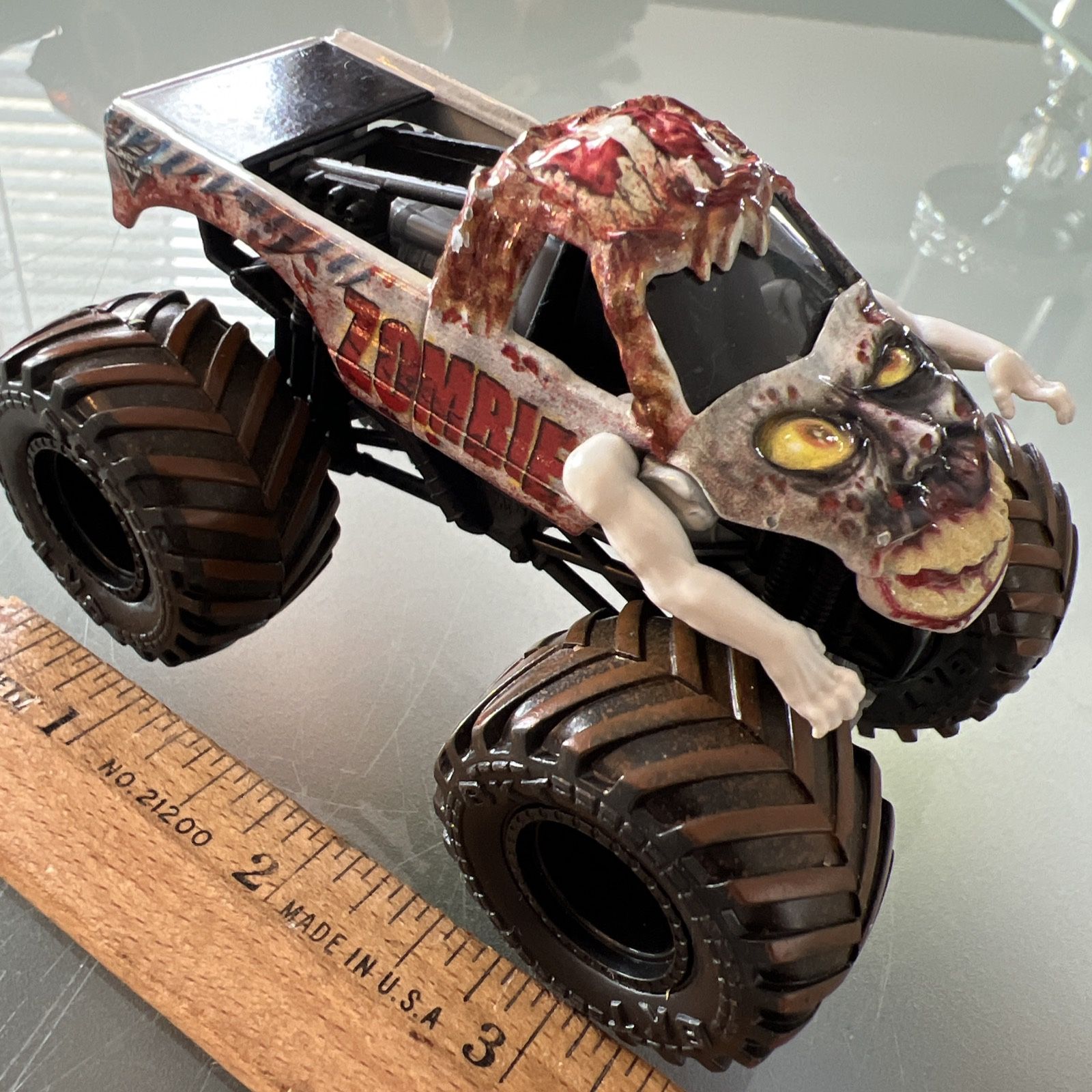Official Monster Jam Zombie Truck With Movable Arms- 1:64