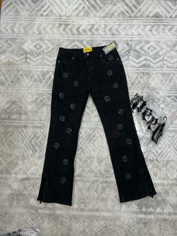 Godspeed black jeans with repeating gray 'G'