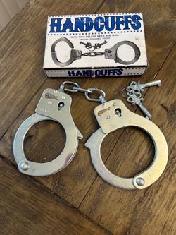 Steel Handcuffs-  similar to  Police Double Locking Real Lock Cuffs with 2 keys can be used for Halloween costume