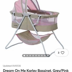 Pink traveling bassinet