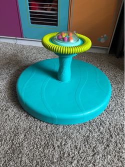 B. toys Spinning Activity Toy