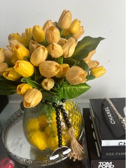 Yellow tulips flower  arrangement with vase