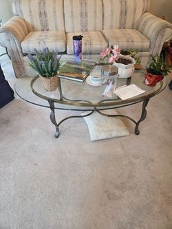 Oval Glass and Metal Coffee Table $15