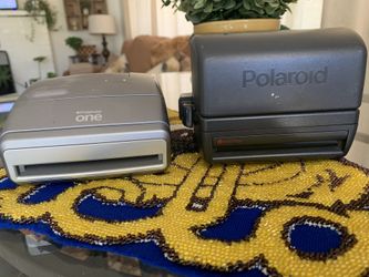 Two Polaroid cameras