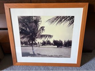 Two identical vintage black-and-white framed photos