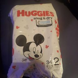 12 Size 2 Huggies Diapers