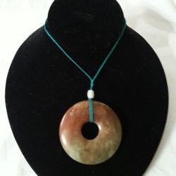 A LARGE CHINESE GOOD LUCK JADE PENDANT