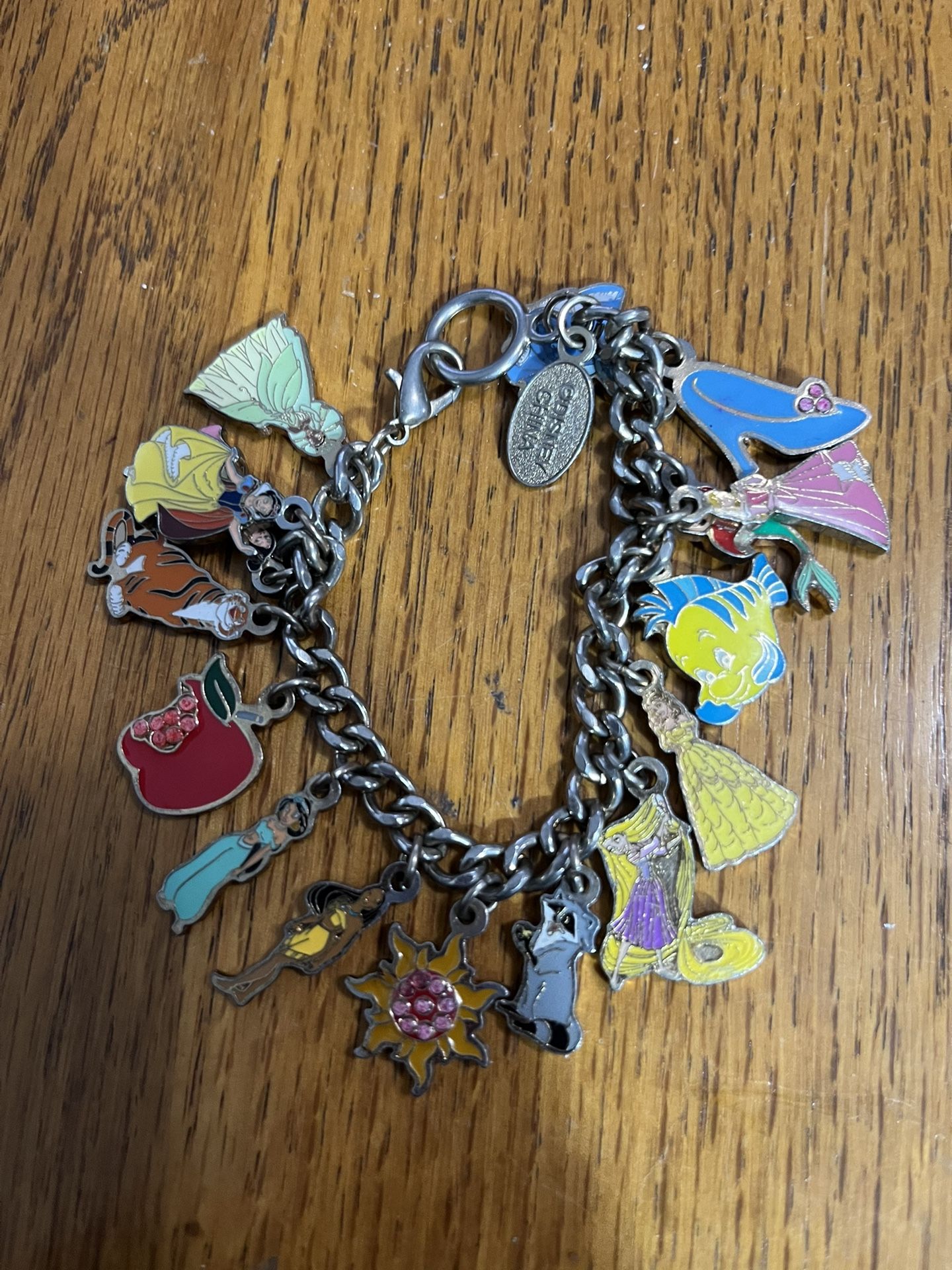 Disney Princess Charm Bracelet. Purchased at Disneyland many years ago. Size 7 inches. Has been stored in a jewelry box. Preowned. Smoke free hom