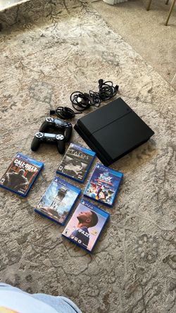PS4 with games and controllers