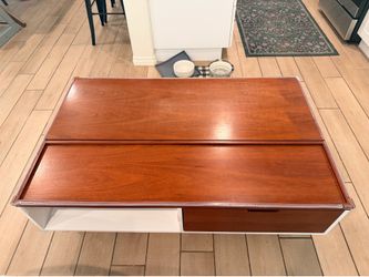 Rising coffee table with storage living spaces