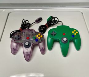 2x GENUINE Nintendo brand N64 video game system Authentic original controller Remote Atomic Purple controllers Green