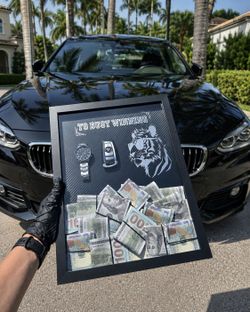 Money picture with BMW keys and a watch