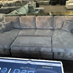 Gray storage and sleeper sectional