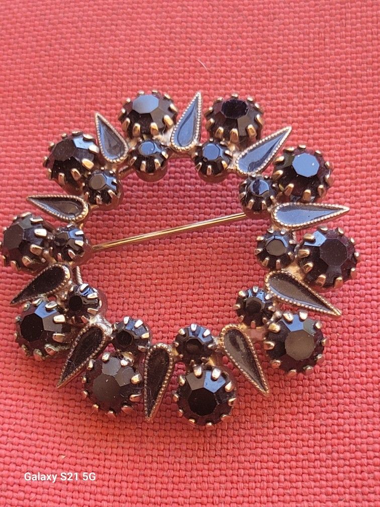 black crystal and enamel brooch