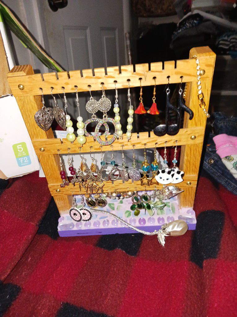 17 Pair Of Earrings Three Brooches And A Jewelry Rack All Together
