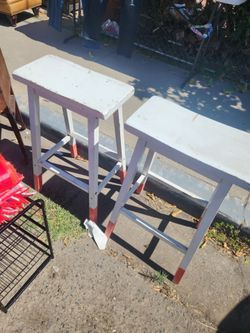 2 white stool bars