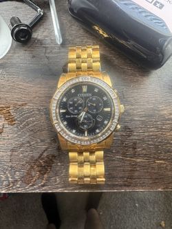 Citizen Calendrier BU2082-56E Eco-Drive gold-tone chronograph with diamond bezel.