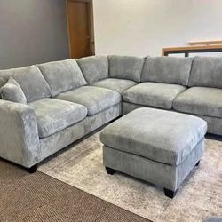 corduroy Sectional Sofa with Ottoman and 2 accent pillows. 