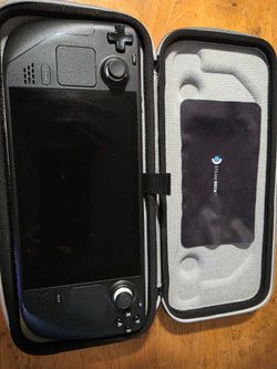 Steam Deck Gen 1 512GB w/ carrying case, cleaning cloth, and dock stand.