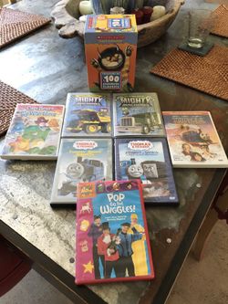 Care Bears DVD and box of various story book dvd's