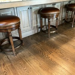 Set Of Three Leather Swivel Barstools