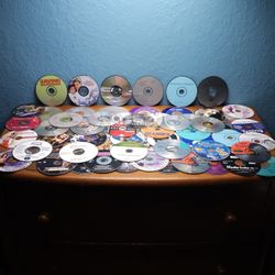 Variety of 69 90s to 2000s CDs and DVDs