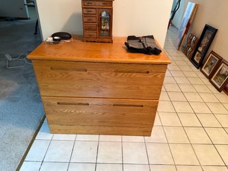Two drawer oak file cabinet with key.