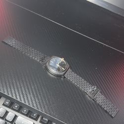 Nixon black watch with gold