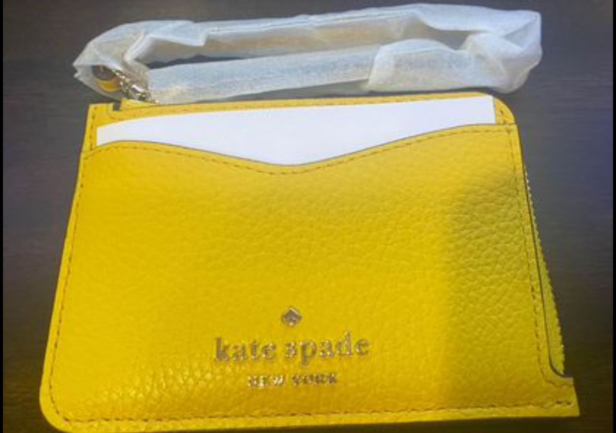 Brand new! Small Kate spade wristlet coin and card wallet. Retail $89
