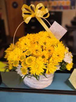 Yellow mix flowers basket