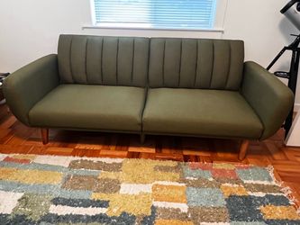 Green futon sofa couch
