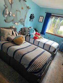 Two twin-size beds with mattresses