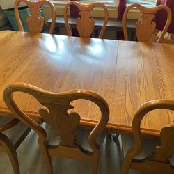 Striking dining table and matching chairs