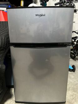 Whirlpool 3.1 cu. ft. Mini Refrigerator with Dual Door True Freezer (Model WH31S1E) in a stainless-steel look finish.