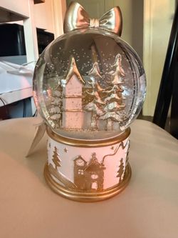 Gold and white snow globe