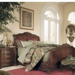 This is an American Drew Bob Mackie Home Sleigh Bed Night Stand & Armoire