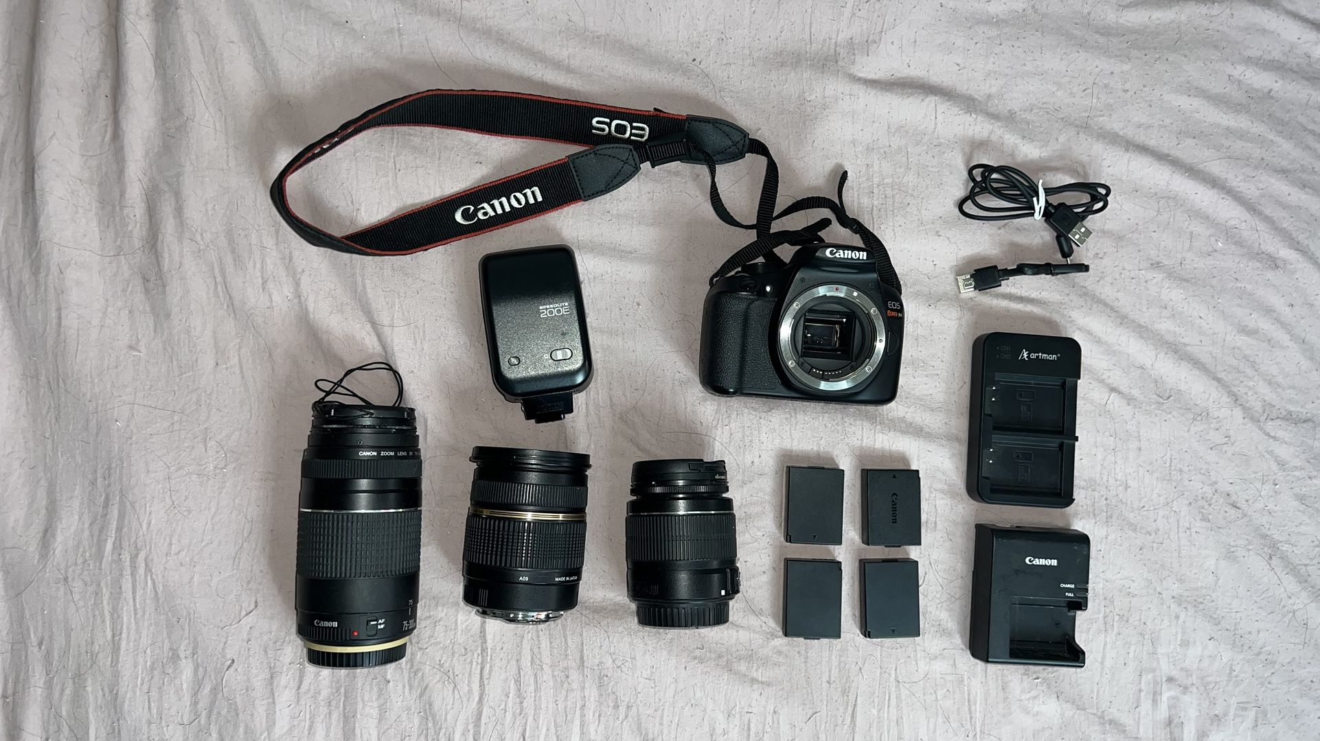 Canon - EOS 2000D / Rebel T6 DSLR Camera PLUS 3 different lenses, a detachable flash, and 4 battery packs. 