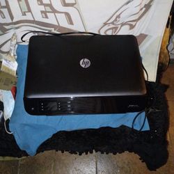 Practically New Used A Couple Times And Put Away In Storage, Still Has Full Cartridge Of Ink  Printer,Scanner,Copy And Photo 