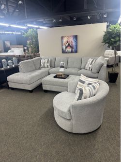 West Elm Gray chenille sectional couch with ottoman and swivel chair