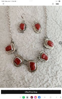 Navajo made Stamped and signed . Sterling silver coral set