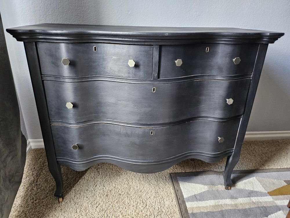 Vintage Serpentine Dresser On Wood Wheels