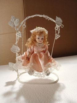 Porcelain Doll on White Metal Swing Stand