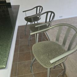 Three swivel counter stools