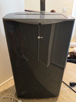 14000BTU LG portable air conditioner with window adapter and hose.