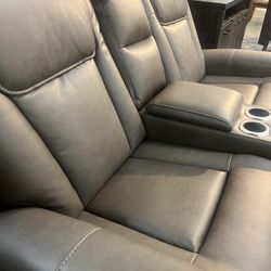 Floor Model Dual Power Reclining Loveseat With Console  