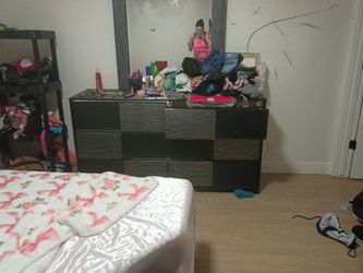 Bedroom dresser and  might stand.