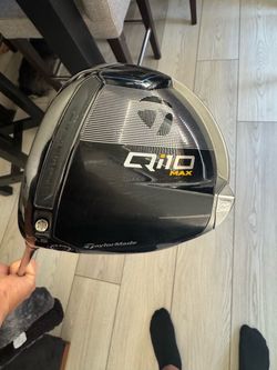 Left TaylorMade Qi10 Max Driver with cover