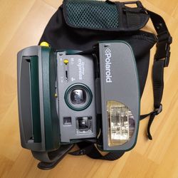 Old-school Poloroid camera with case
