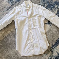 Thom Browne men shirt size 2 like size M Purchased at south coast mall original price was $650 before tax. Let me know if you need details photos